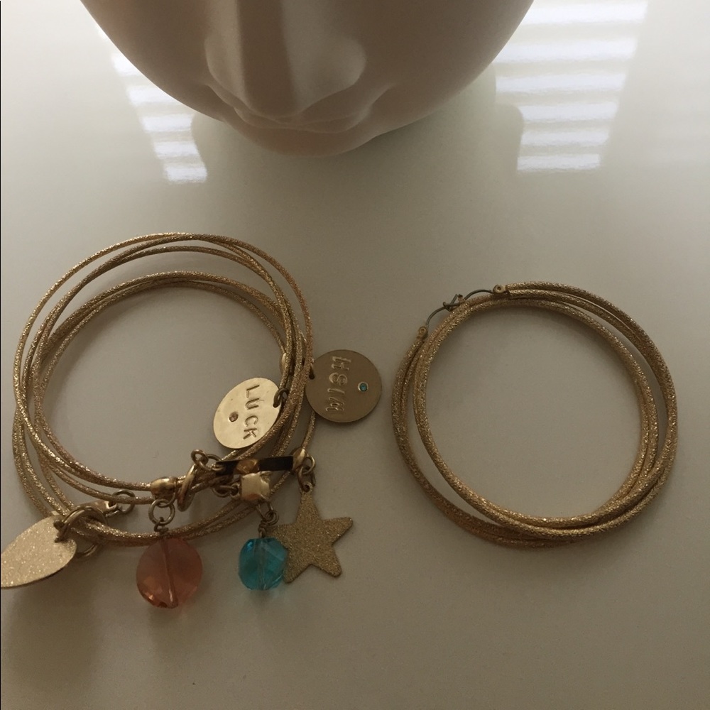 Earrings and matching bangles with charms.
